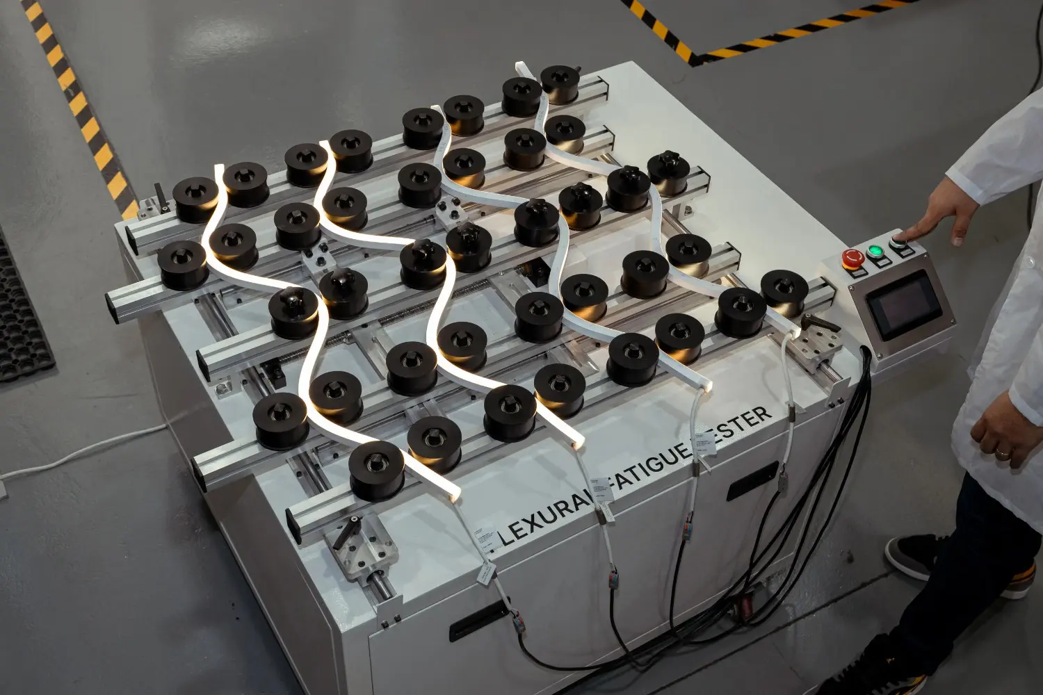 Engineer conducting performance validation using lighting fatigue testing equipment at LEDFlex